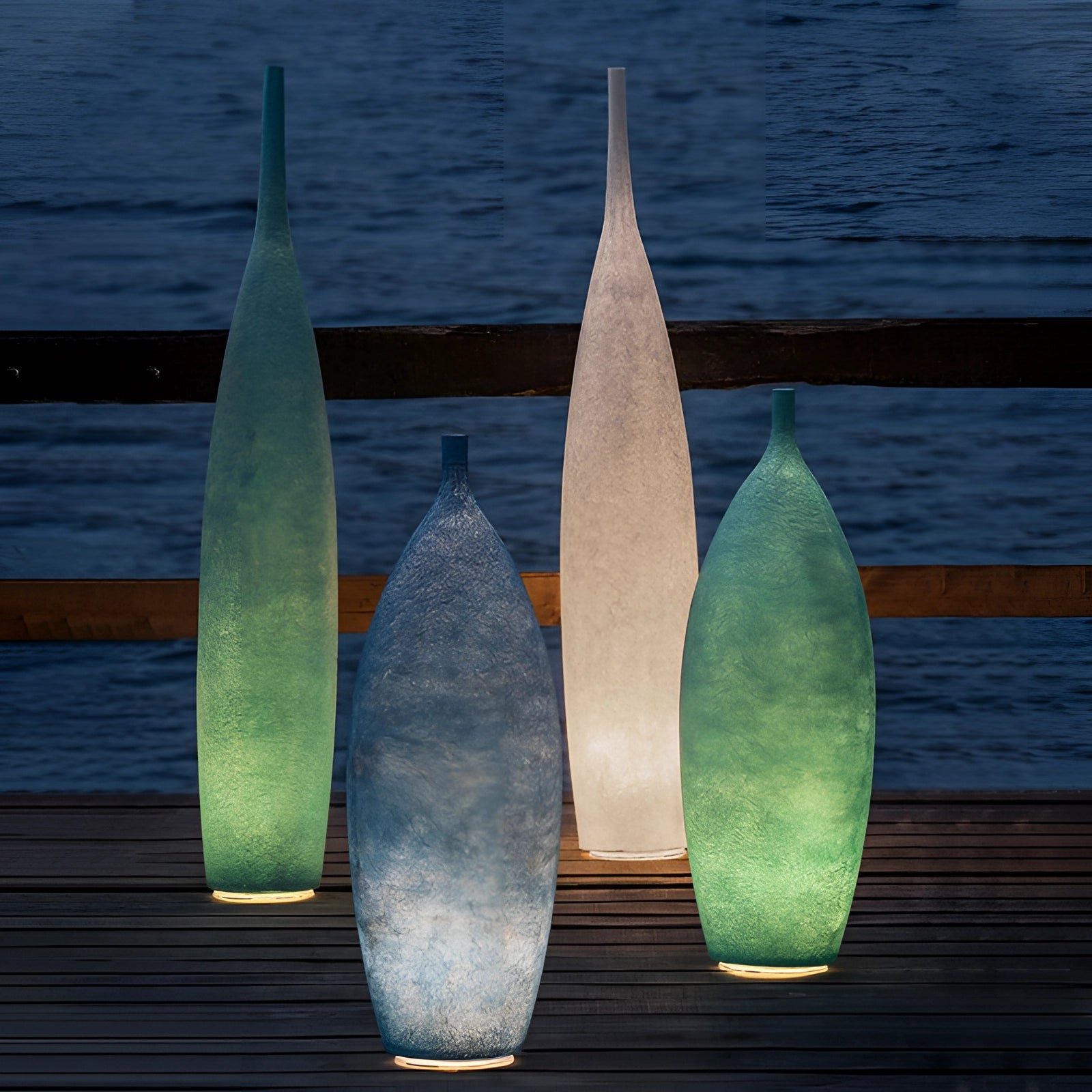 Green Scandinavian minimalist tall narrow ceramic vase with a distressed finish, standing 56 inches high, featuring a cone-like shape with a symmetrical design.