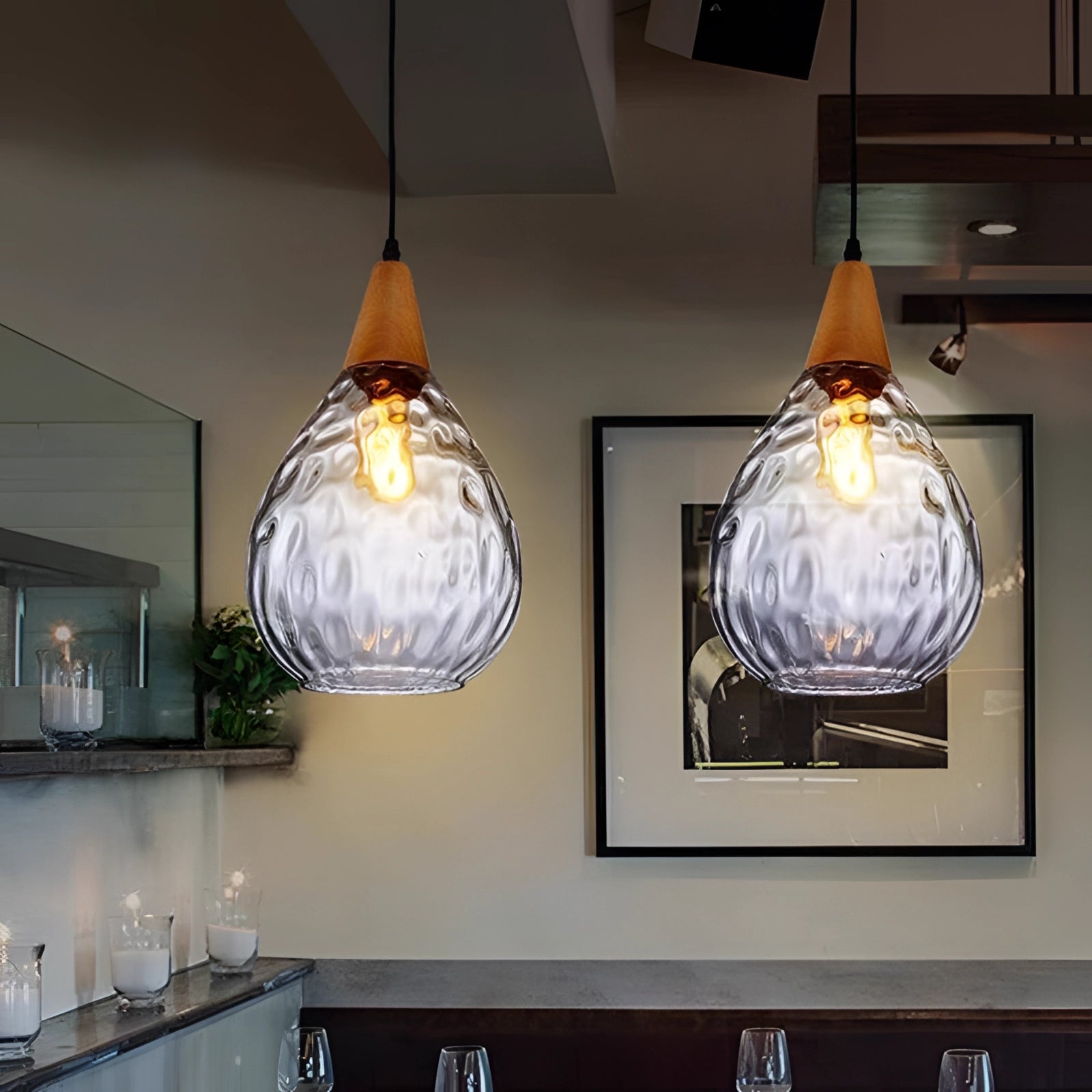 Scandinavian Teardrop Pendant Light with a clear glass shade and wood accent, designed for ceiling installation in interior spaces.