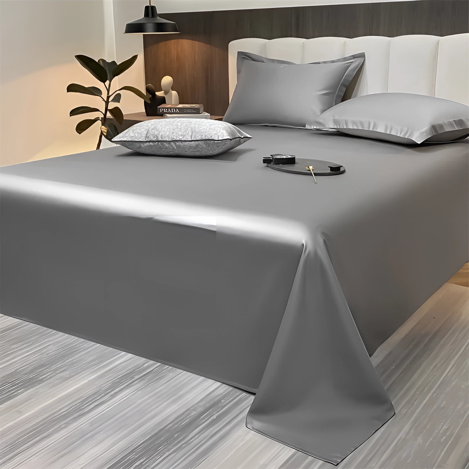 Sea green silky luxury bed sheets in a modern minimalist bedroom setting, featuring gray sheets in a 245x265cm size, surrounded by sleek, minimalist furniture and decor elements.