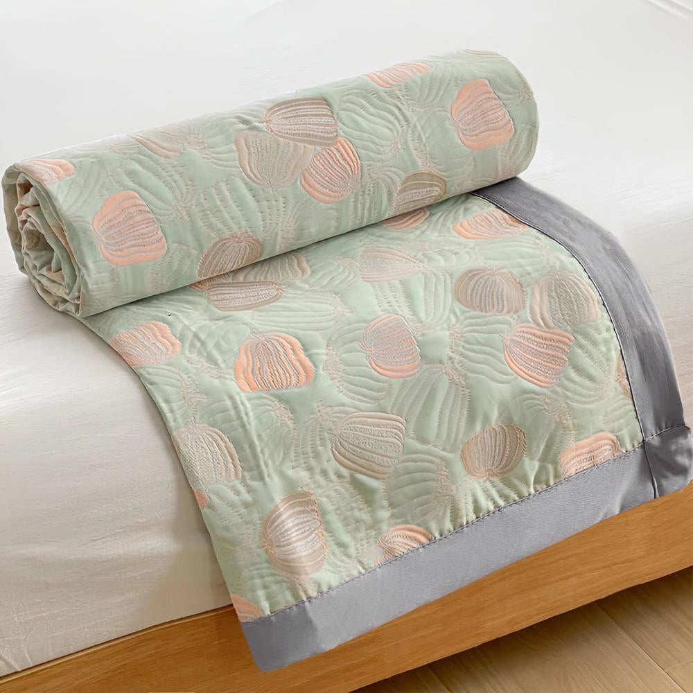 Ocean-inspired duvet cover with pastel beach theme featuring seashell patterns on a rectangular bedding set.