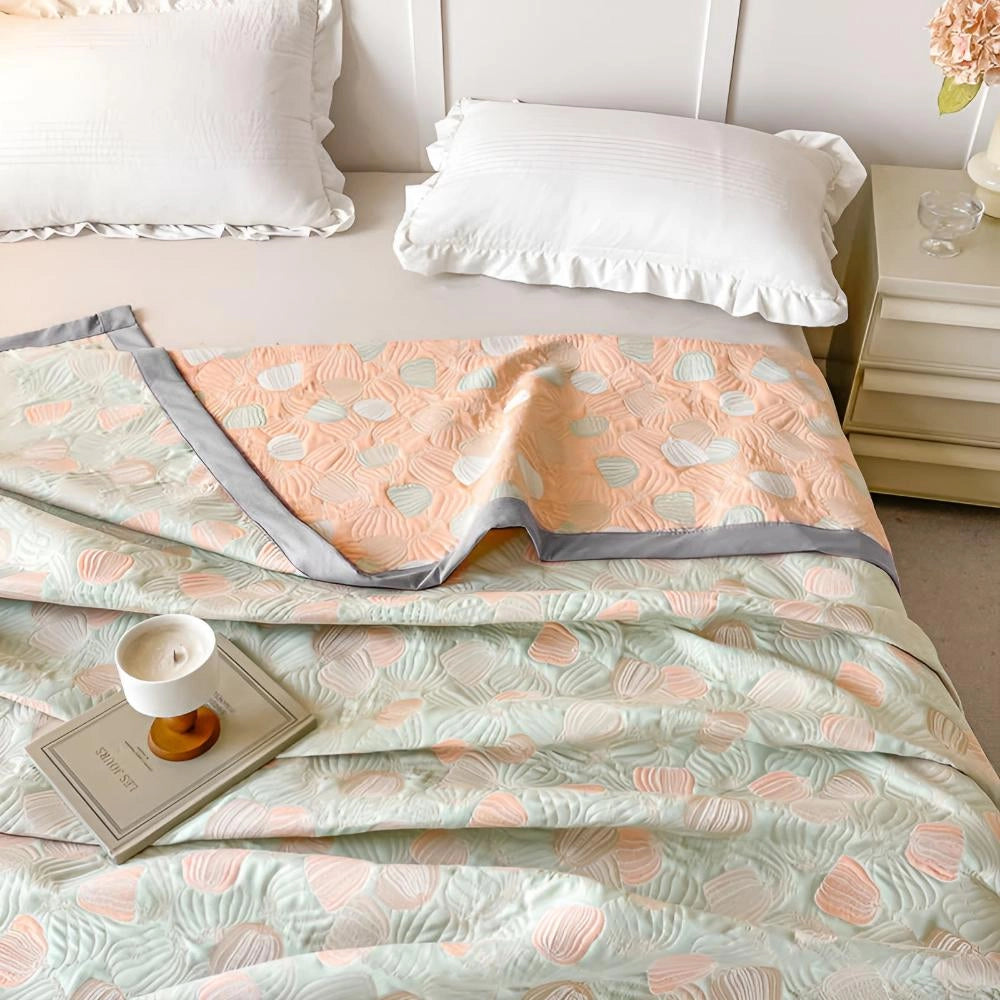 Ocean-inspired duvet cover with seashell motifs in pastel beach theme, featuring a comfortable bed setup with white and aqua accents, wooden bed frame, and coordinating pillows.