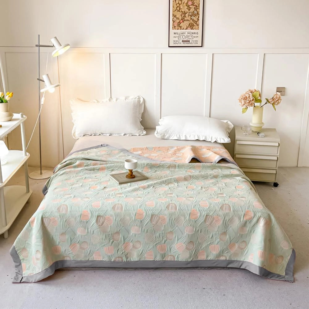 Seashell bedding with an ocean-inspired duvet cover in a pastel beach theme displayed on a bed with a wooden frame in a cozy, well-designed bedroom interior.