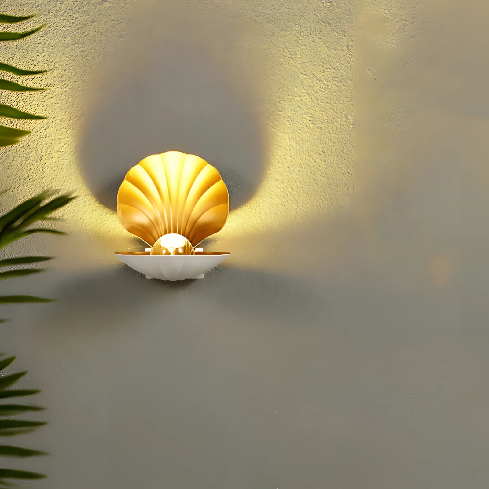 Seashell Table Lamp with a gold accent, featuring a coastal nautical design. The lamp emits a warm glow, with a visible light bulb and artistic details, set against a soft background.