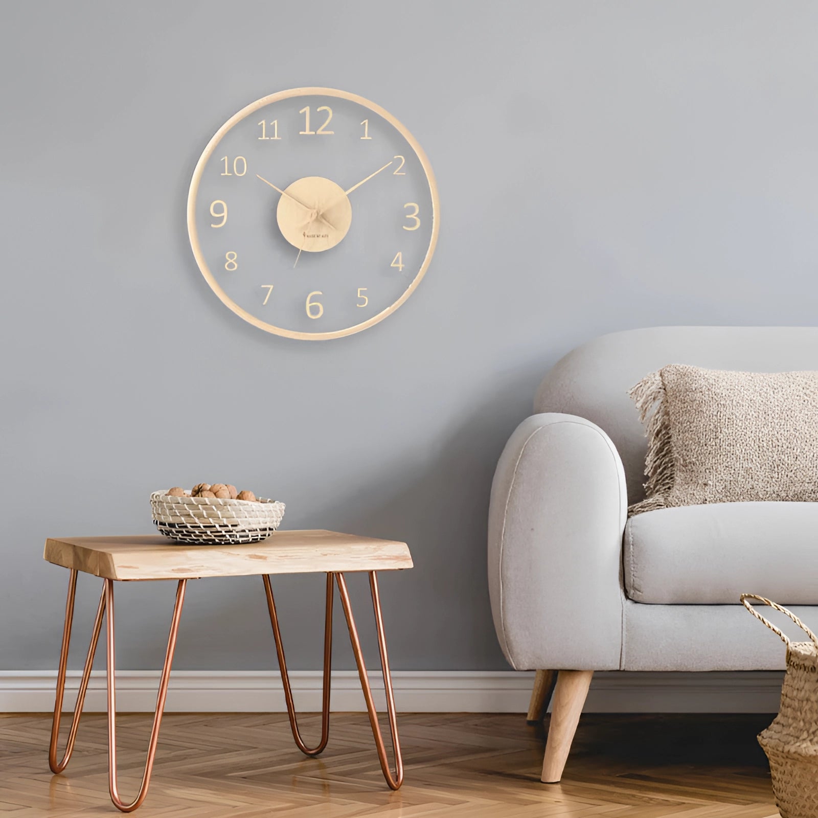 Minimalist silent Scandinavian light wood clock with a rectangular shape, featuring subtle shades of grey and beige, placed on a wooden table in an elegantly designed interior space.