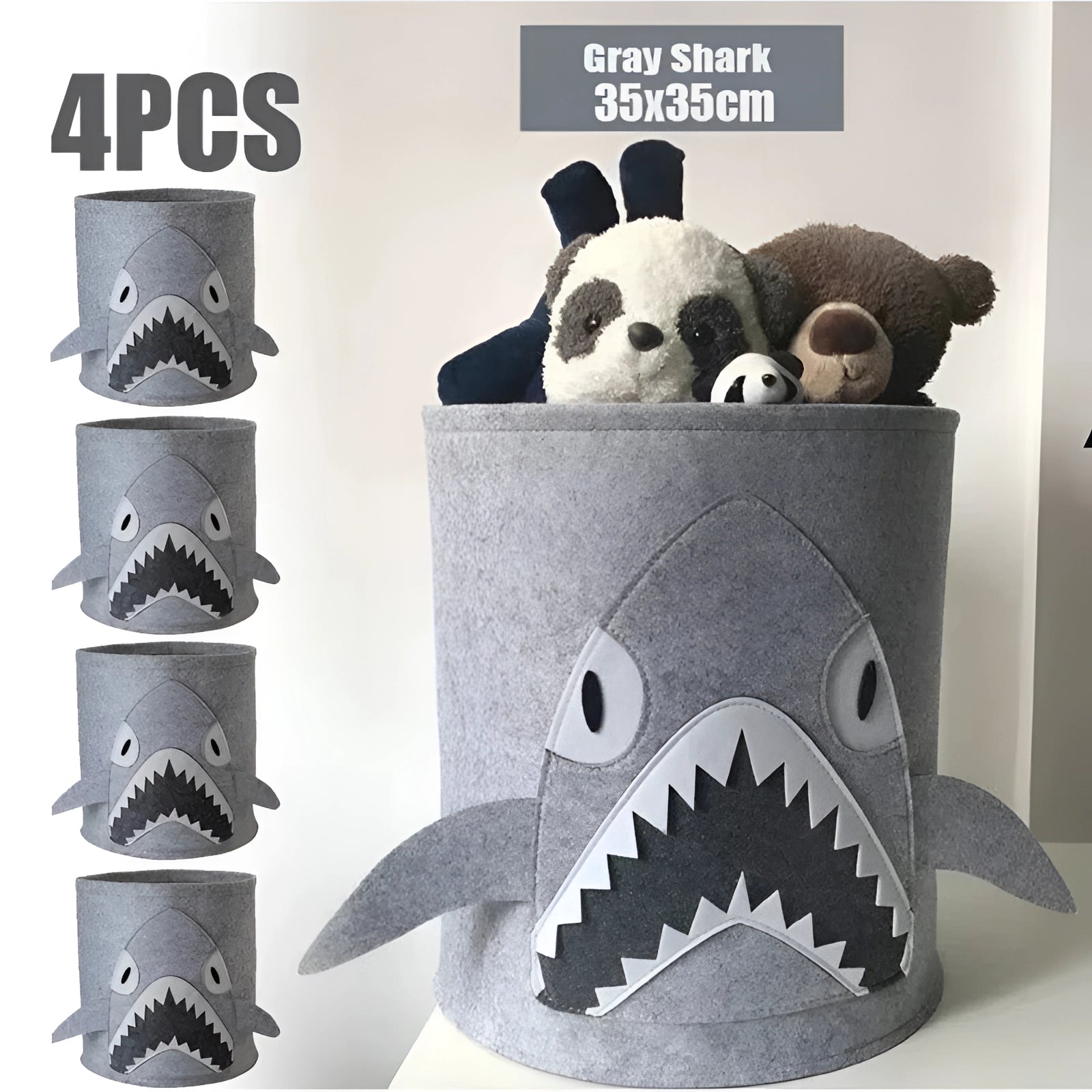 Gray felt basket designed to resemble a shark, featuring a playful, cartoonish design with four distinct parts including a snout and fin elements; used for kids' toy storage or as a nursery organizer.