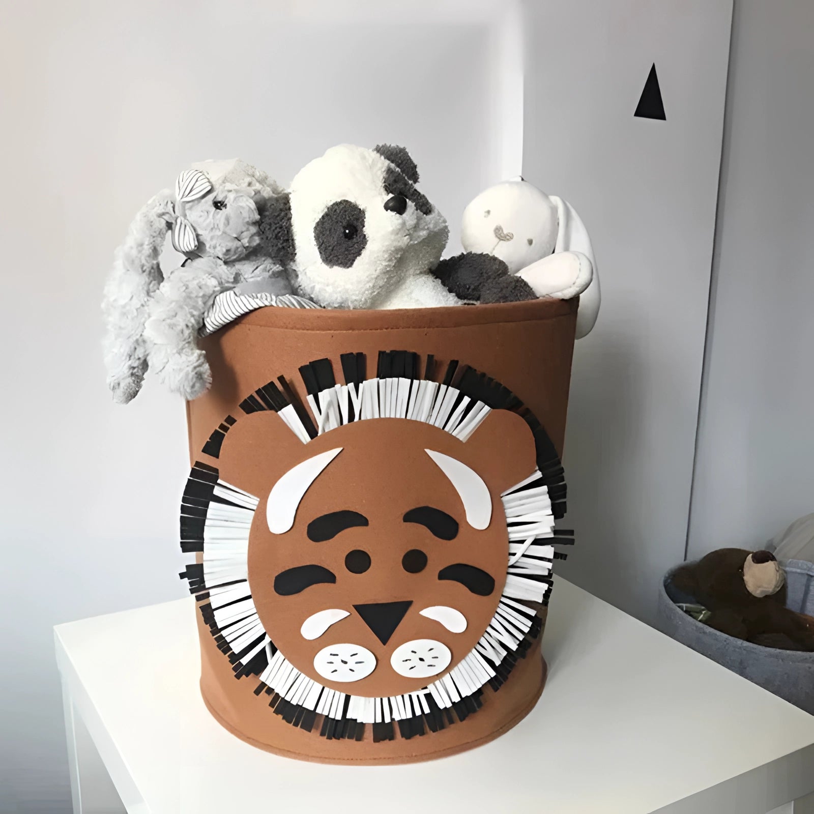 Gray felt shark-shaped basket for kids' toy storage, designed as a nursery bin featuring a playful cartoon-like shark face.