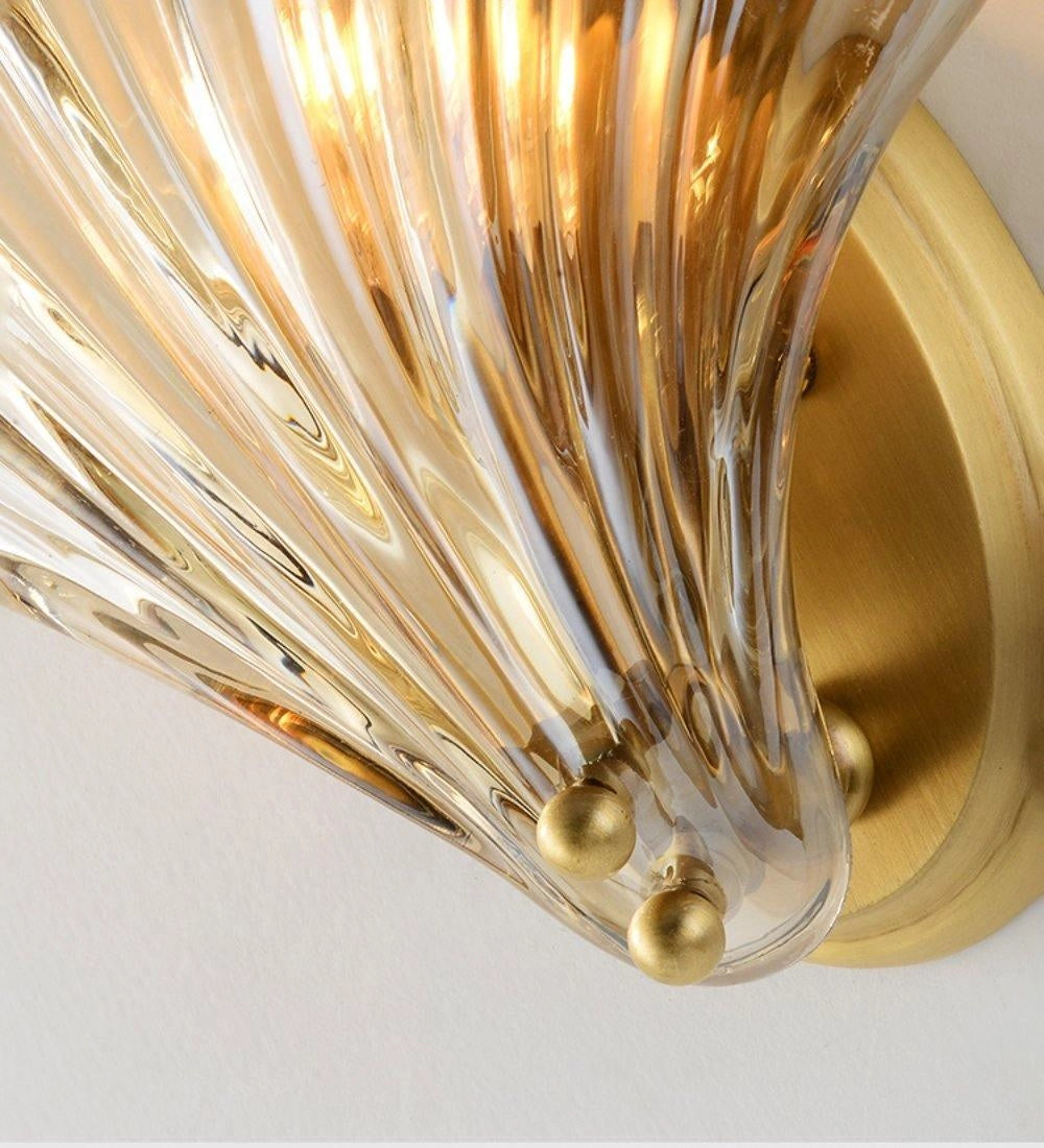 Gold Shell Wall Sconce featuring a nautical coastal seashell design.