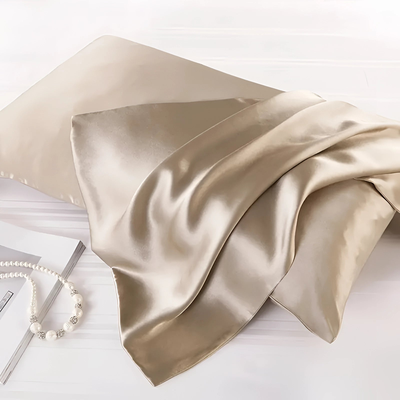A beige silk slip dress made from luxurious satin, designed for both evening wear and chic loungewear. The dress features a sleek and comfortable fit with delicate satin fabric, showcasing elegance and style.