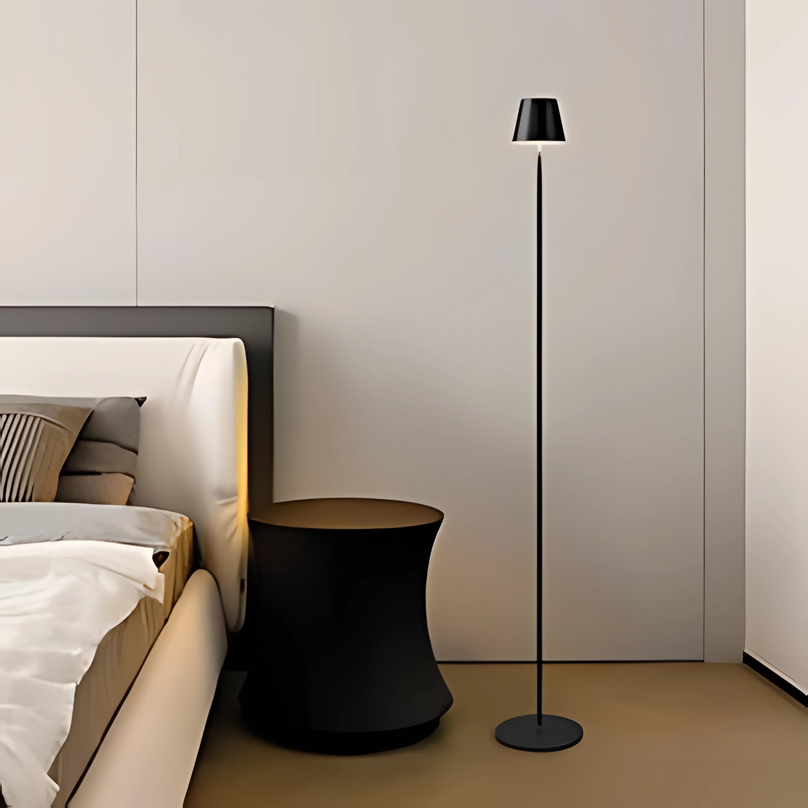 A modern LED floor lamp with a sleek design stands on hardwood flooring, complementing the urban home decor with its minimalist style. A comfortable club chair with an armrest is nearby, enhancing the cozy atmosphere.