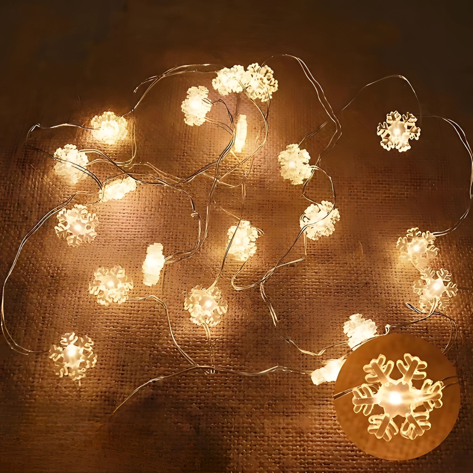 Snowflakes-themed snowman LED string lights in warm white, creating a festive holiday ambiance, with intricate snowflake designs that evoke a wintery charm.