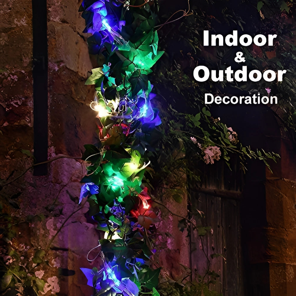 Solar powered outdoor LED fairy lights wrapped around a branch of an evergreen tree, emitting a purple and electric blue glow, suitable for Christmas decoration and other festive outdoor settings.