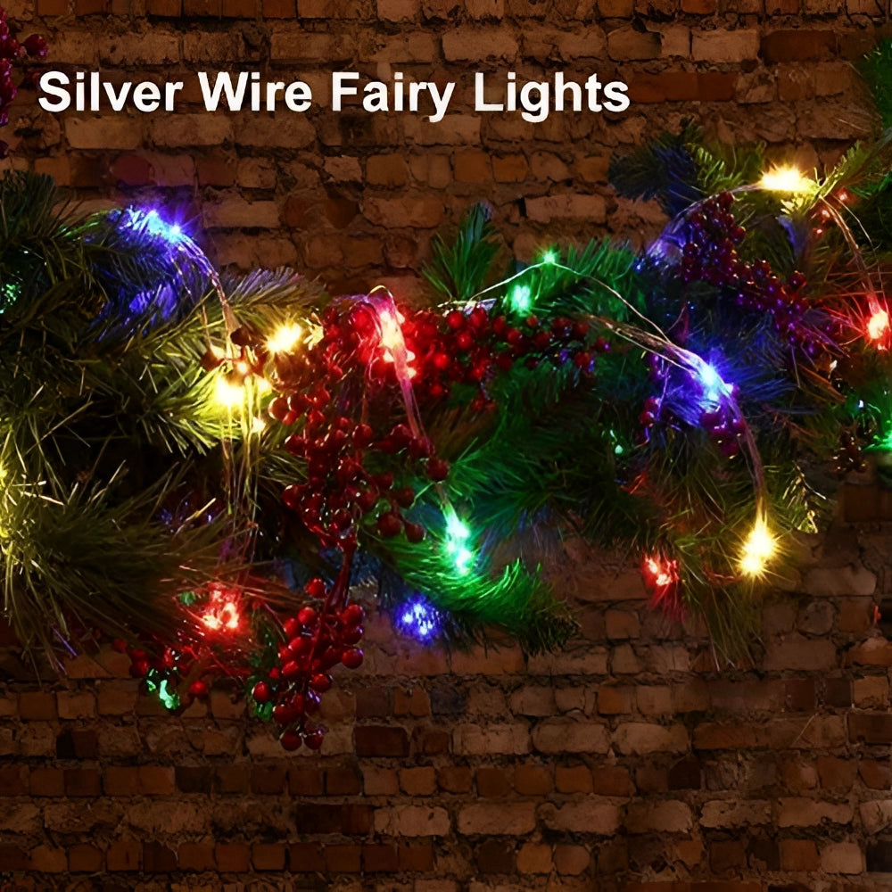 Solar powered outdoor LED fairy lights elegantly draped over an evergreen branch, creating a festive and eco-friendly holiday decoration suitable for outdoor use.