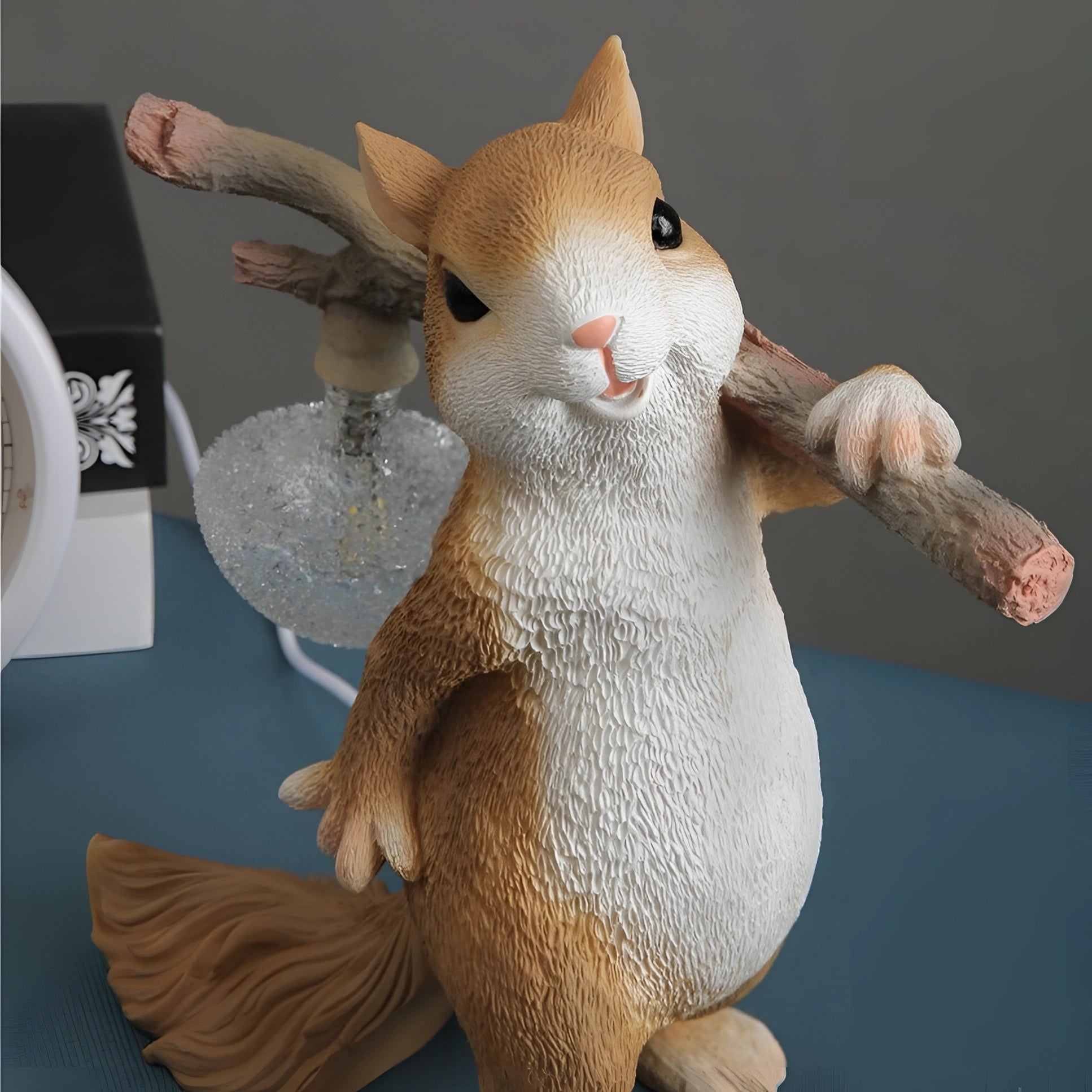 Whimsical resin squirrel lamp with detailed facial features and realistic texture, perfect for nature-inspired home decor.
