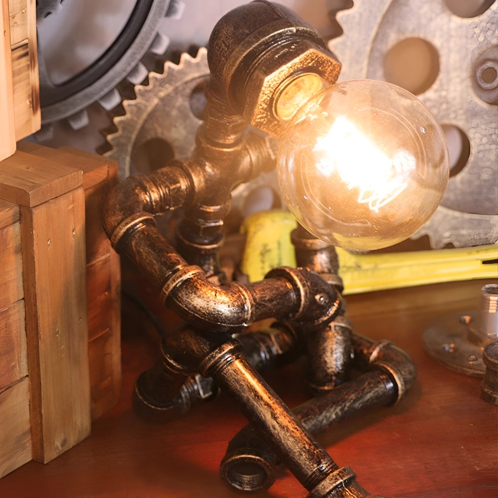 Steampunk industrial pipe table lamp with a vintage gear design, featuring a combination of metal and wood elements, and a bronze finish, displayed in a room setting.