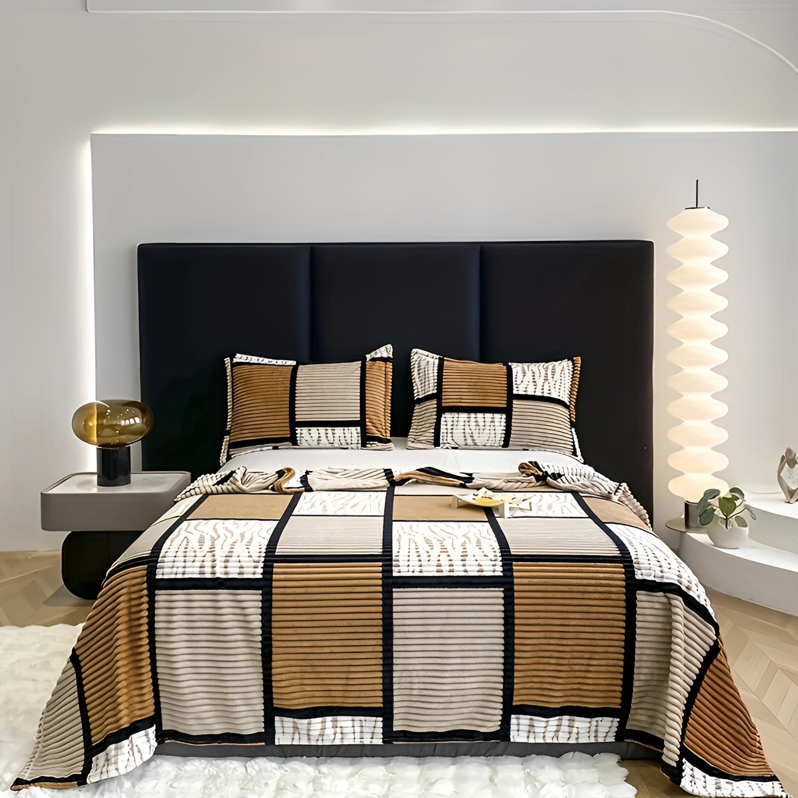 Modern geometric quilt bedding set in brown tones displayed on a bed with a wooden frame in a contemporary bedroom setting, featuring a neatly arranged pillow, a lamp with a shade, and minimalist interior design elements.