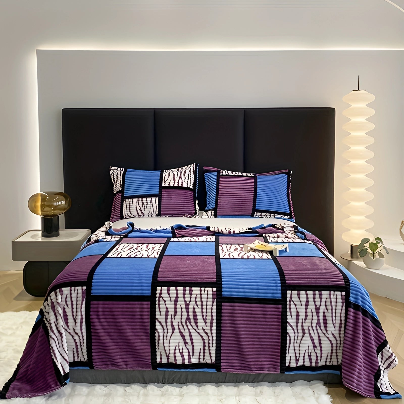 Blue and purple geometric striped bedding set displayed on a bed in a contemporary bedroom setting, highlighting modern design and comfort.