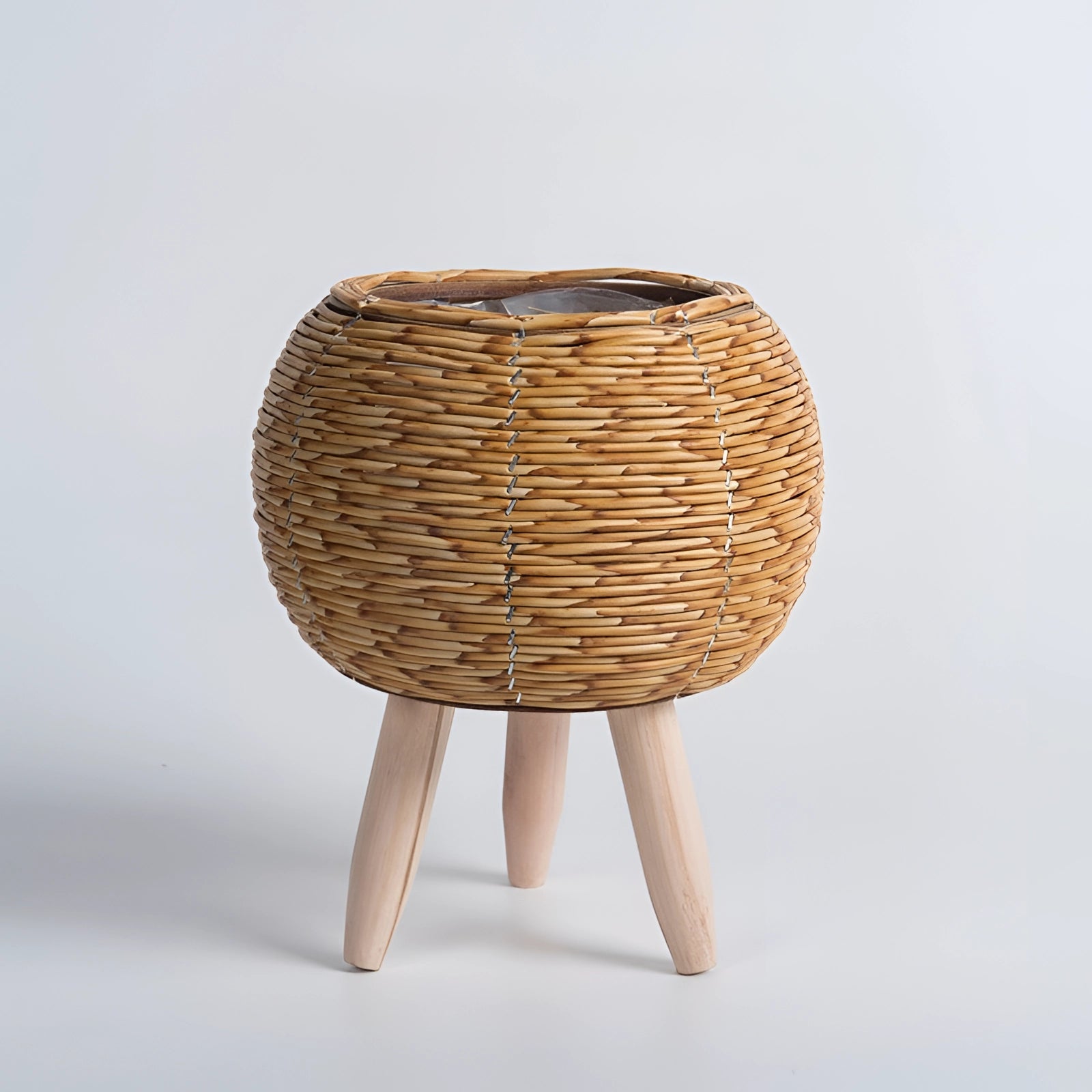 Stylish rectangular wicker planter with bamboo stand and legs, featuring natural wood materials and a sleek design.