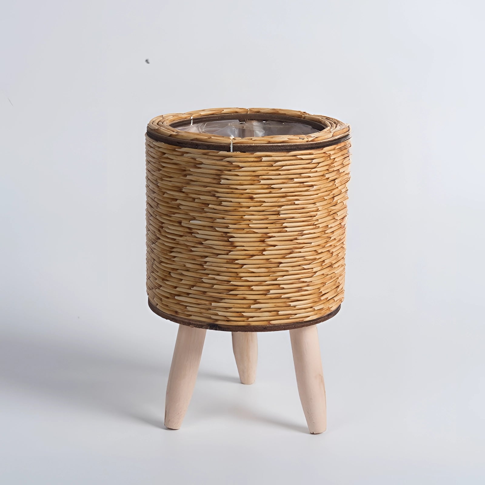 
A stylish eco-friendly wicker planter featuring a bamboo stand and legs with a natural material design.