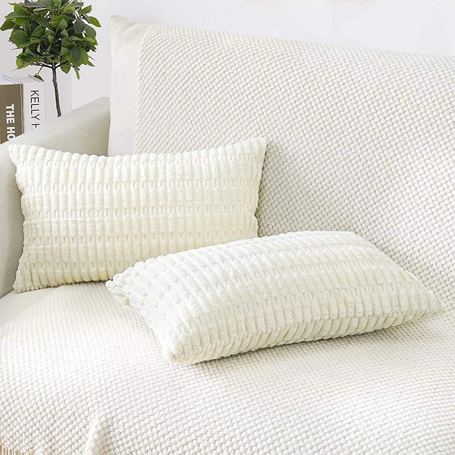 Beige corduroy cushions and lumbar pillows arranged on a beige sofa, providing comfort and a touch of elegance to the living room interior.