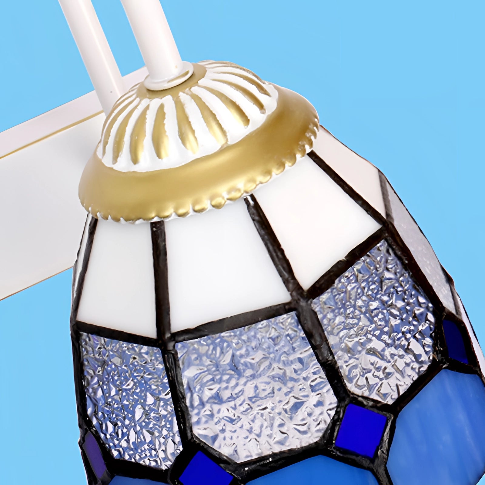 Tiffany stained glass floral wall sconce featuring a dual lamp fixture with intricate circular patterns in vibrant colors, prominently showcasing electric blue accents.