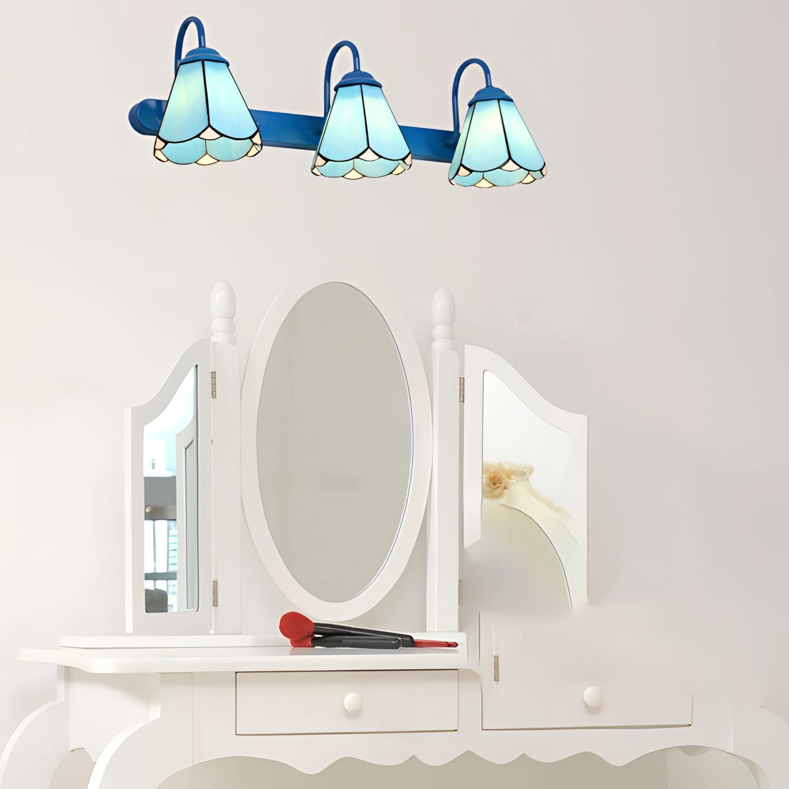 Tiffany stained glass floral wall sconce with a dual lamp fixture featuring a beautifully ornate design, showcasing colorful floral patterns and elegant curves in a mix of stained glass pieces, mounted on a background with a white and metallic finish.