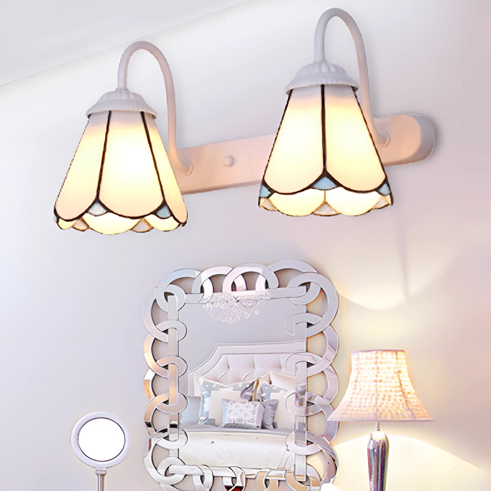 Tiffany stained glass floral wall sconce with dual lamp fixture, featuring intricate floral patterns in colored stained glass, mounted on a wooden wall with a soft white light illuminating the interior space.