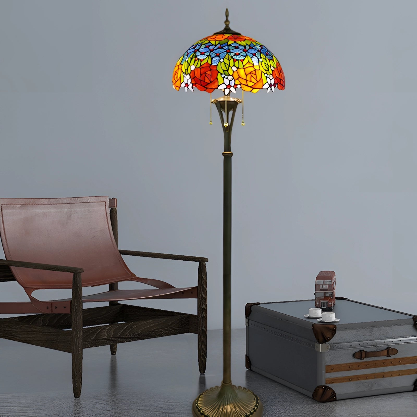 Tiffany-style floor lamp with a stained glass design featuring vibrant peacock feathers, standing on a wooden base with intricate detailing.