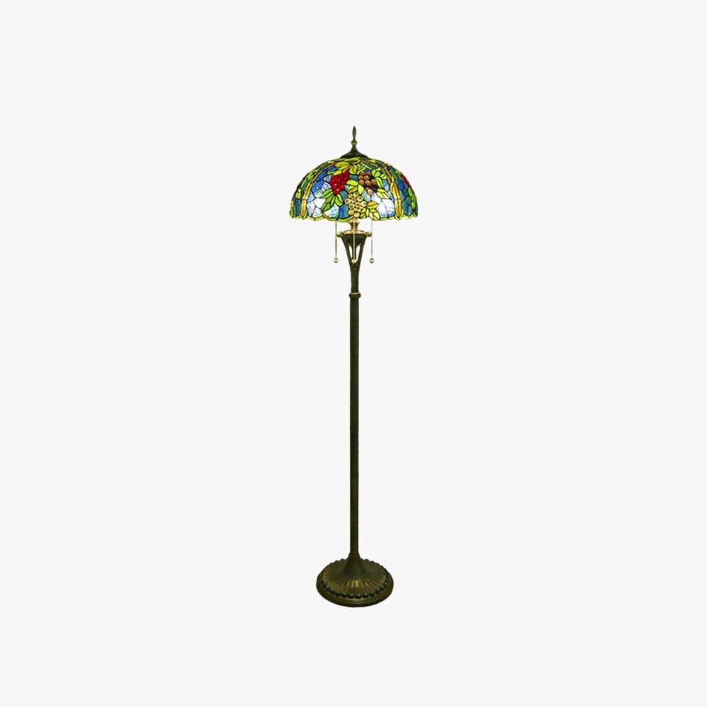 Tiffany-style floor lamp featuring a stained glass lampshade with a peacock feather design, showcasing intricate art and vibrant colors, set on a classic lamp stand.