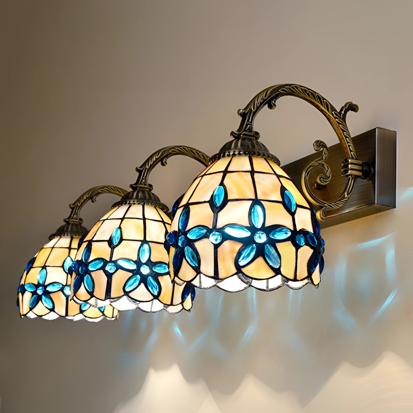 Tiffany-style vintage flower wall lamp featuring a stained glass design with vibrant colors and intricate floral patterns, mounted on a wall providing elegant and artistic lighting.