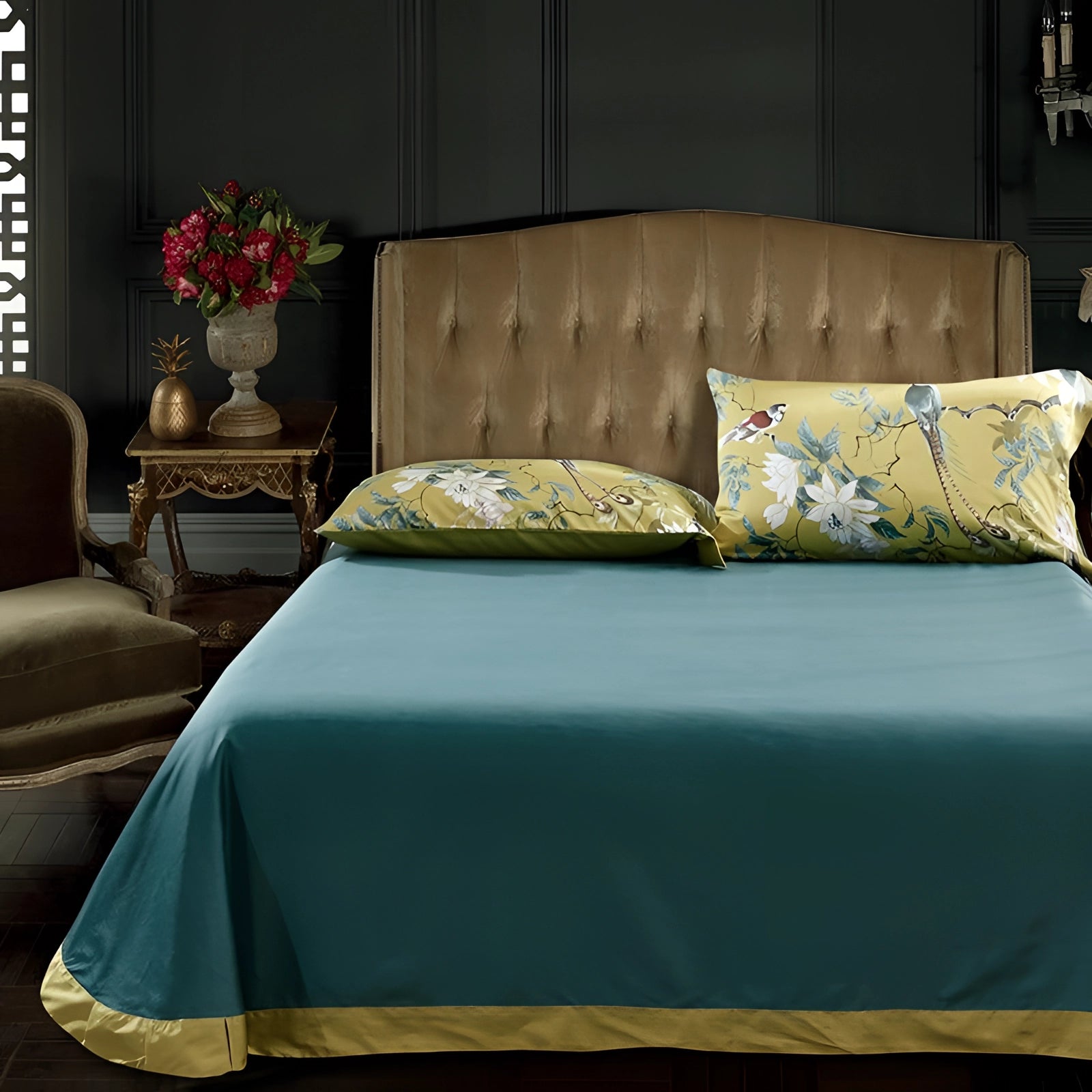 Yellow bird print and floral bedspread from a tropical bedding set, featuring pillows and textiles adding a decorative touch to the interior design.