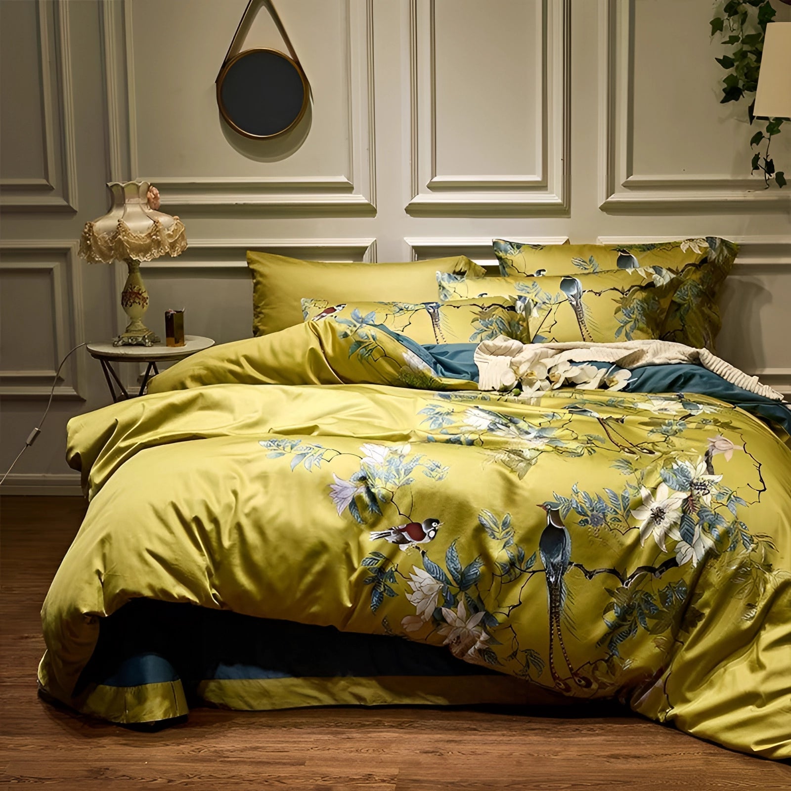 Tropical bedding set featuring a vibrant yellow bird print and floral design on a bedspread, displayed in a cozy bedroom setting with wooden furniture and soft lighting.
