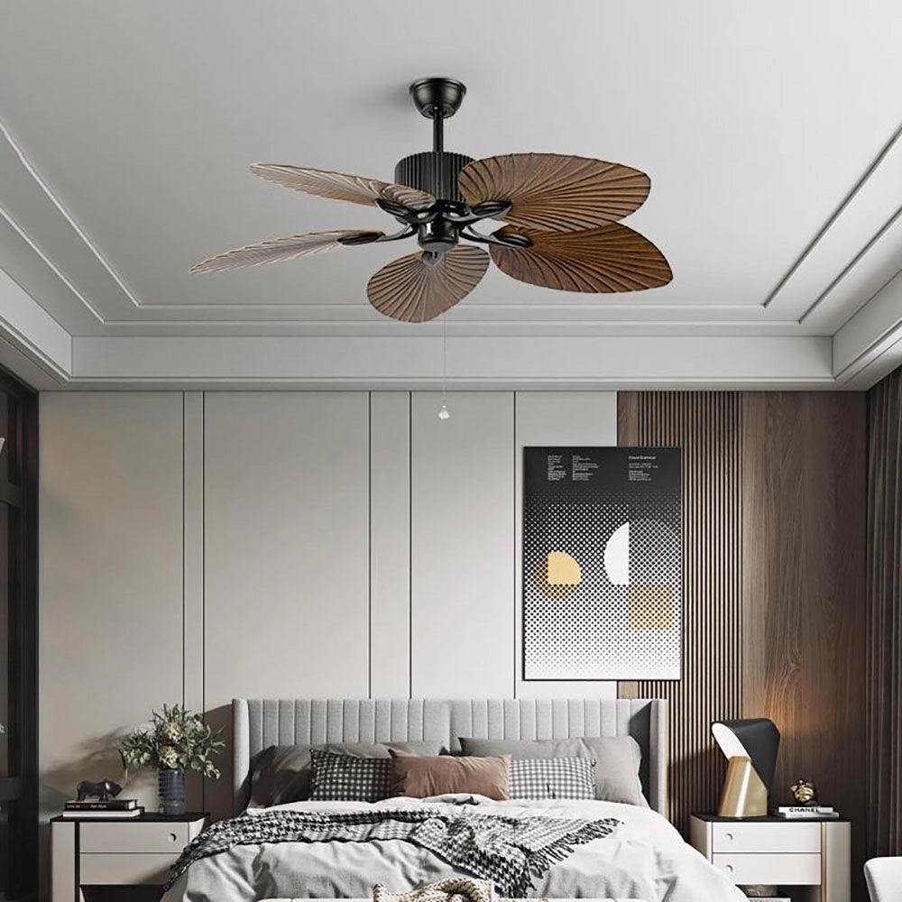 A black ceiling fan with five palm leaf blades, designed for tropical indoor settings, featuring a combination of black and wood tones, adding comfort and style to interior designs.