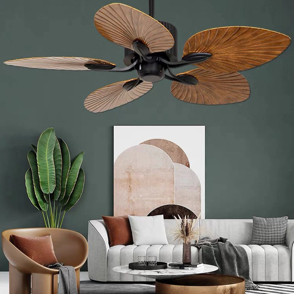 Black five-blade tropical indoor ceiling fan with palm leaf-shaped blades, shown in an interior setting with a focus on its design elements.