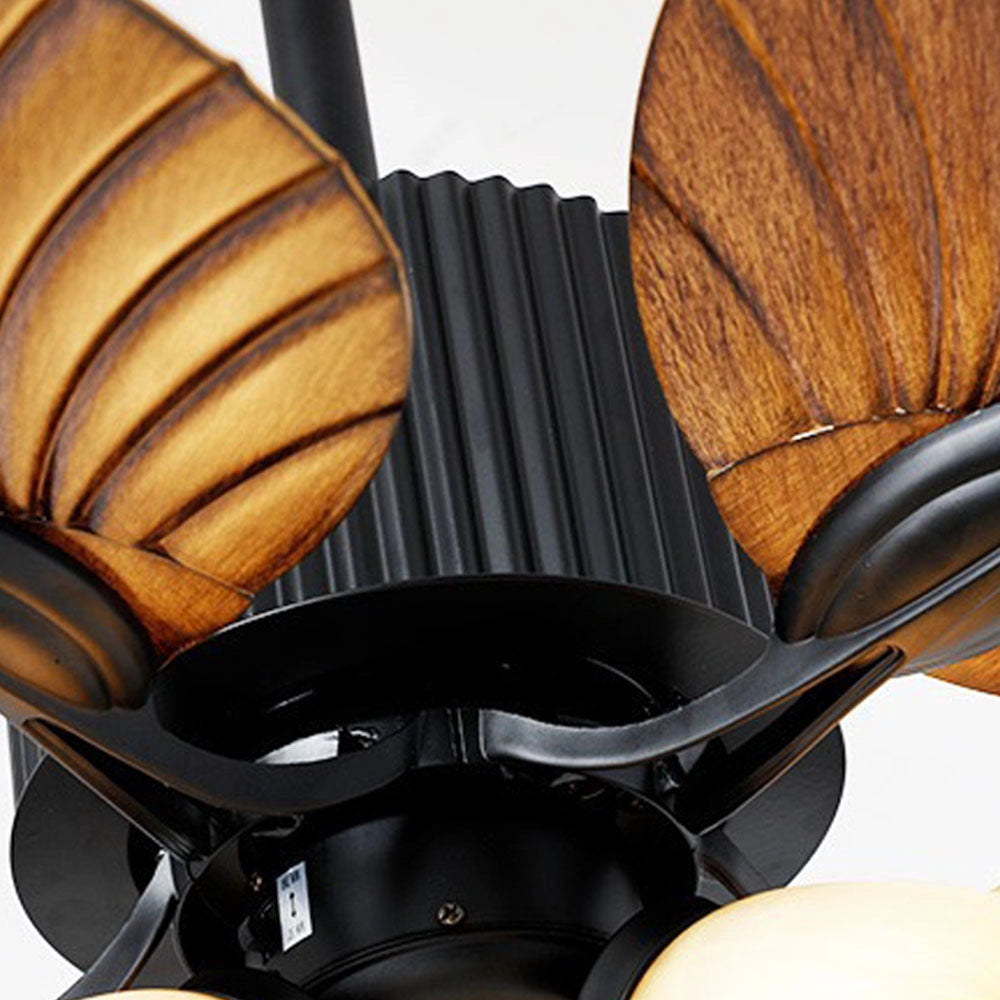 Black tropical indoor ceiling fan with five palm leaf-shaped blades.