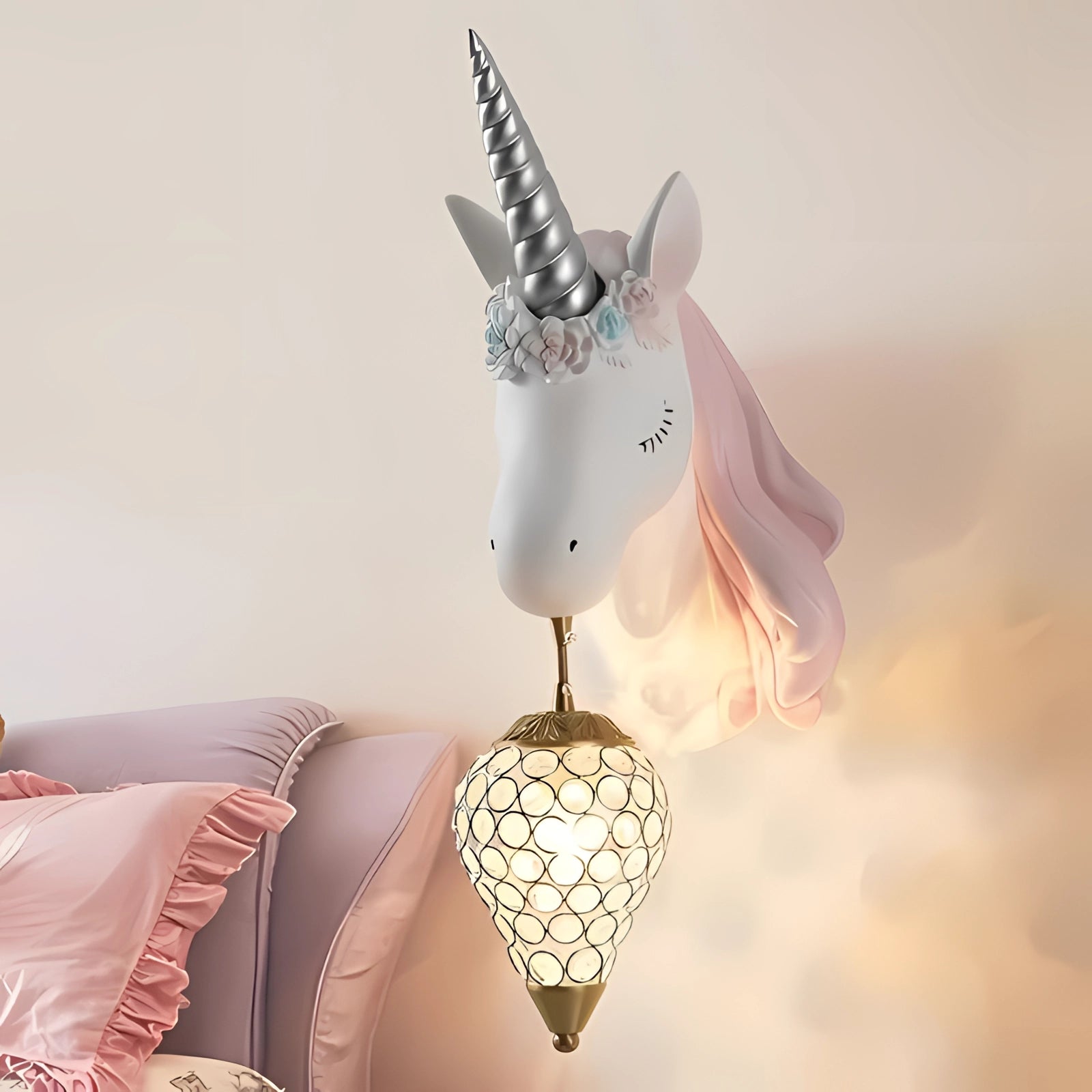 Unicorn-shaped pink wall lamp adorned with crystals, designed as a whimsical and magical decor piece for nurseries or bedrooms.
