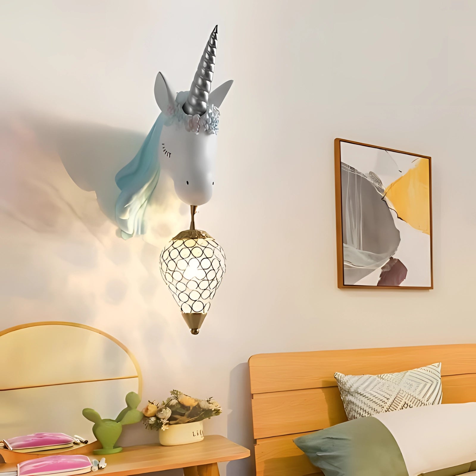 Unicorn wall lamp adorned with crystals, providing enchanting lighting for a nursery or bedroom setting.