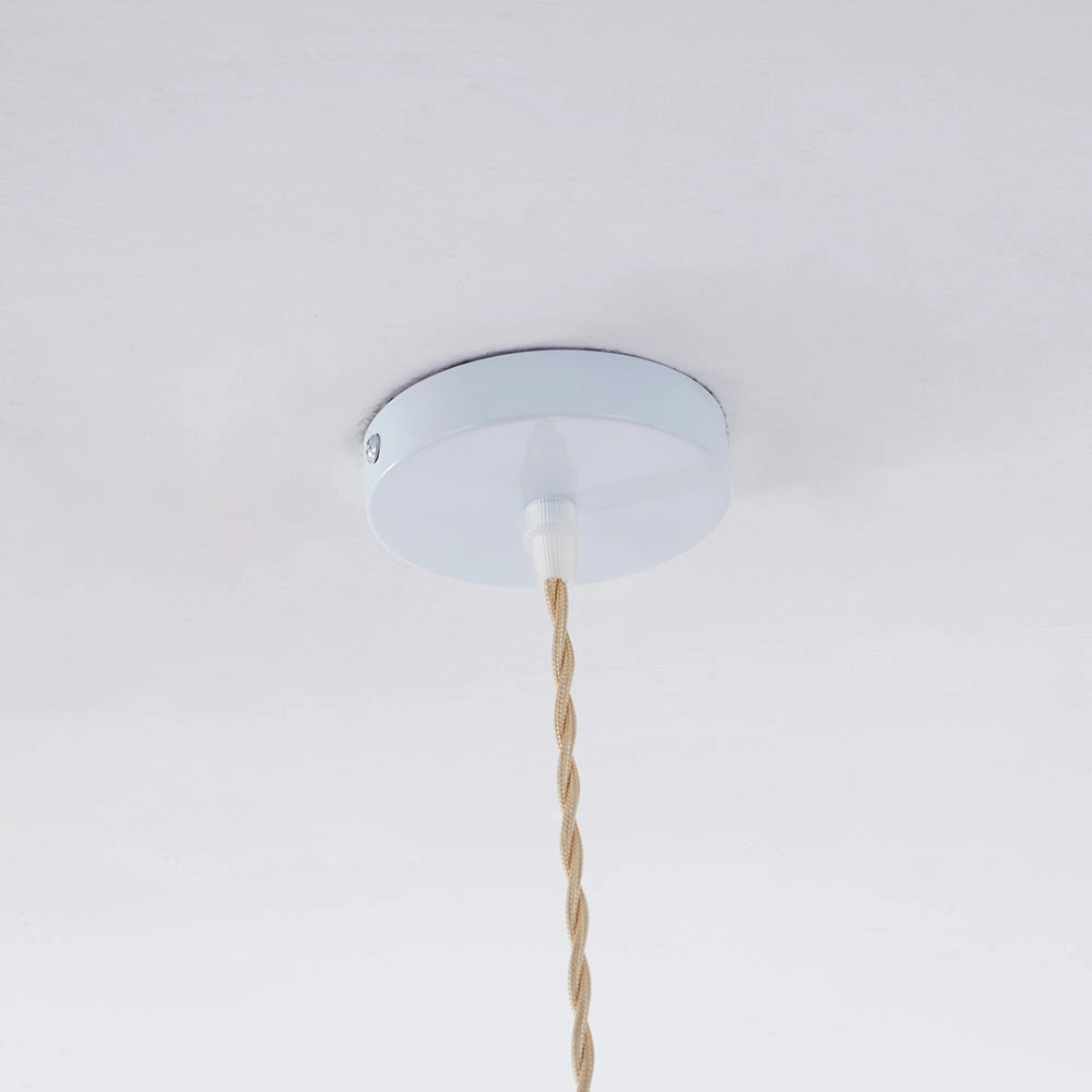 Unique modern LED pendant light with a round brown and beige design, hanging from the ceiling.
