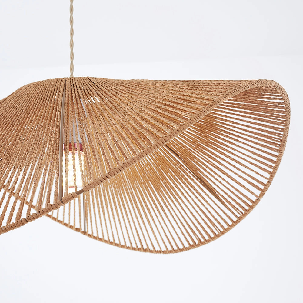 Unique modern LED pendant light with a brown and beige shade, hanging above a wooden surface with plants in the background.