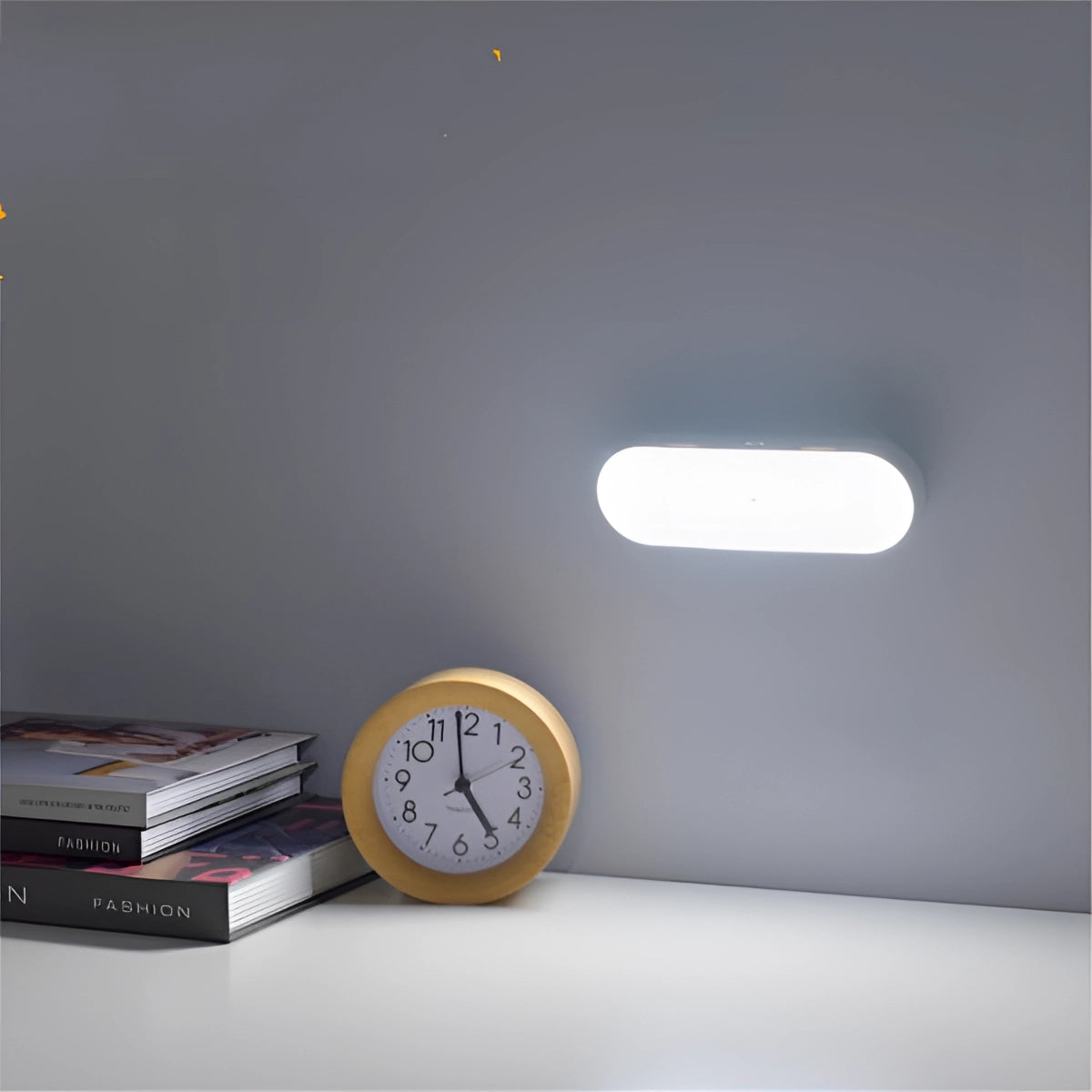 USB LED Wireless Motion Sensor Lamp in white, featuring a compact and energy-efficient design, positioned on a wooden surface.