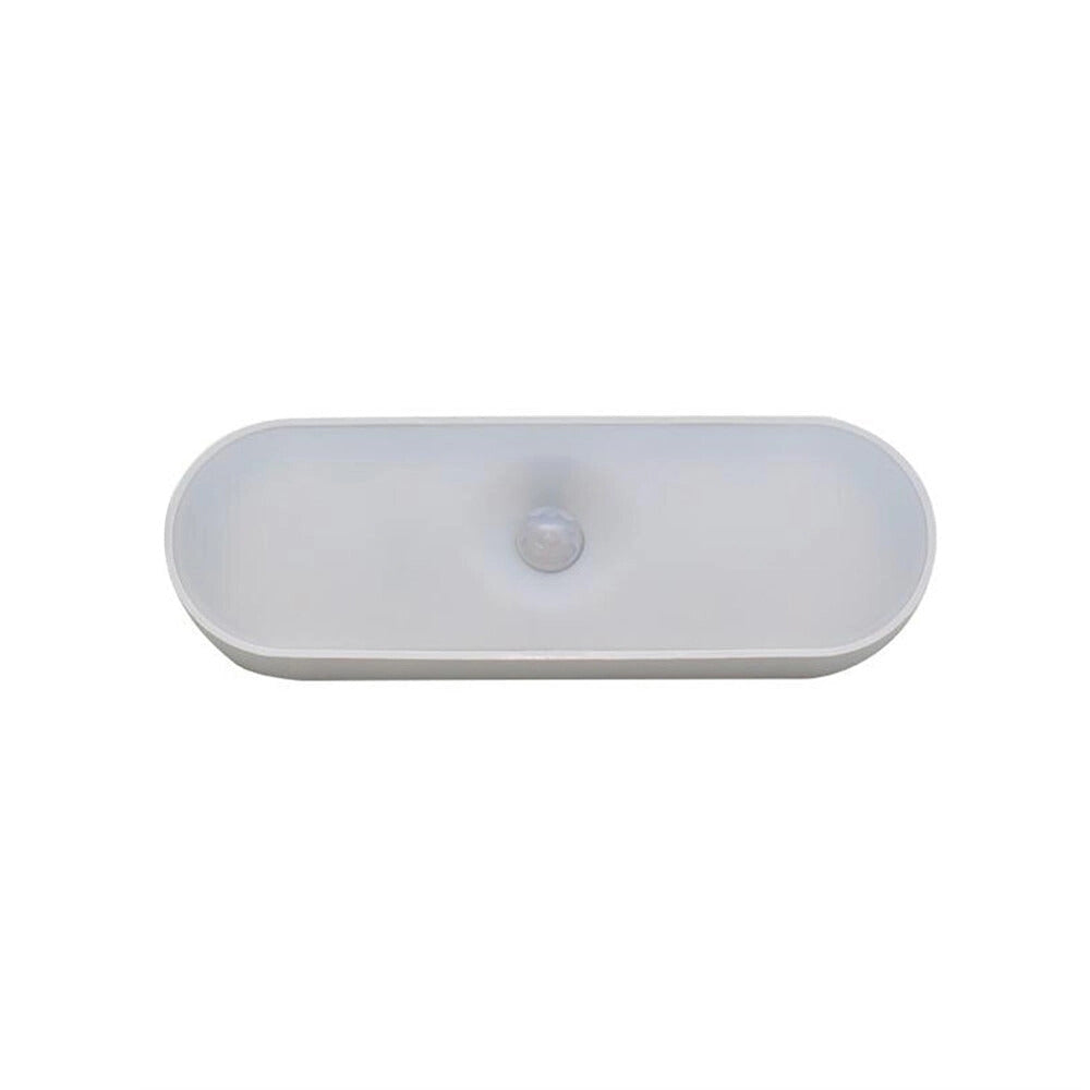 USB LED wireless motion sensor lamp with a compact and energy-efficient design, featuring a sleek rectangular shape and electric blue color, suitable for enhancing ambient lighting in various settings.