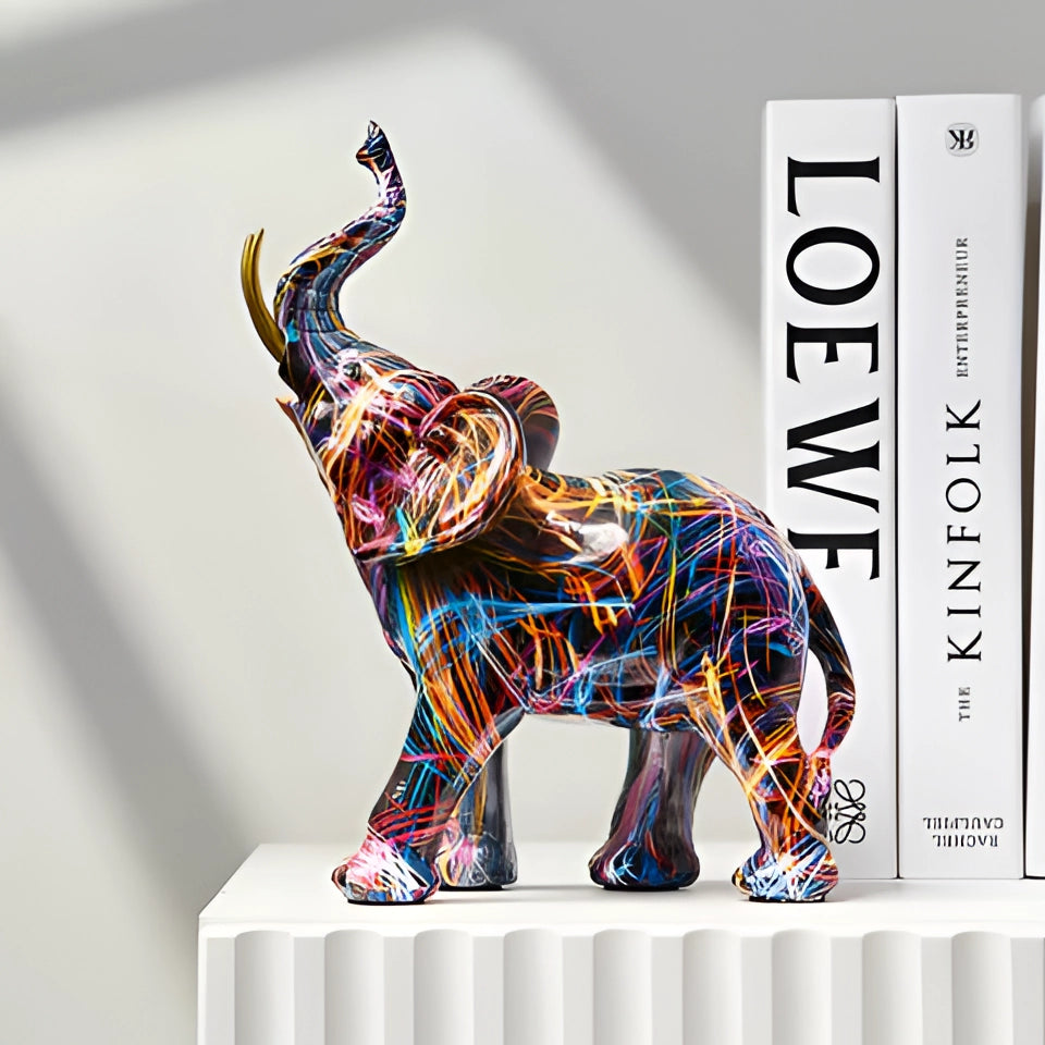 Vibrant multicolor abstract elephant sculpture featuring a unique and artistic design, showcasing a creative blend of colors and patterns to enhance any decor.