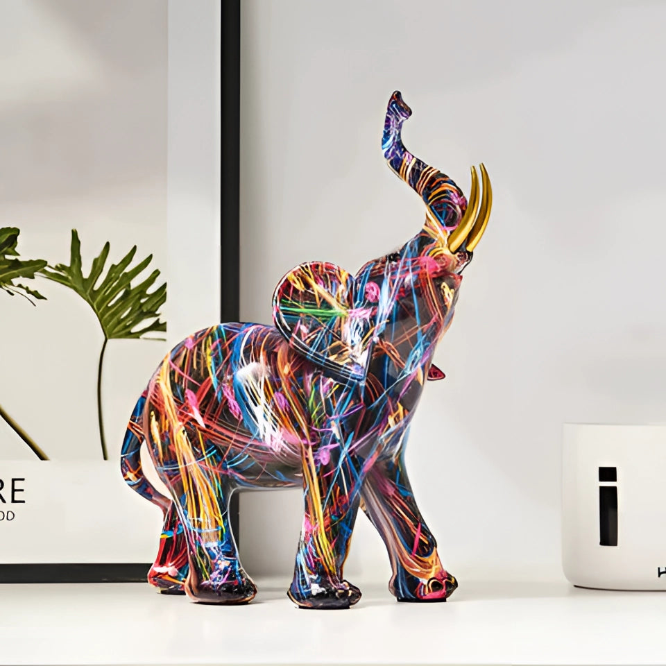 Unique abstract sculpture of a multicolored elephant, showcasing vibrant hues and creative artistry, serving as a distinctive piece of decor.