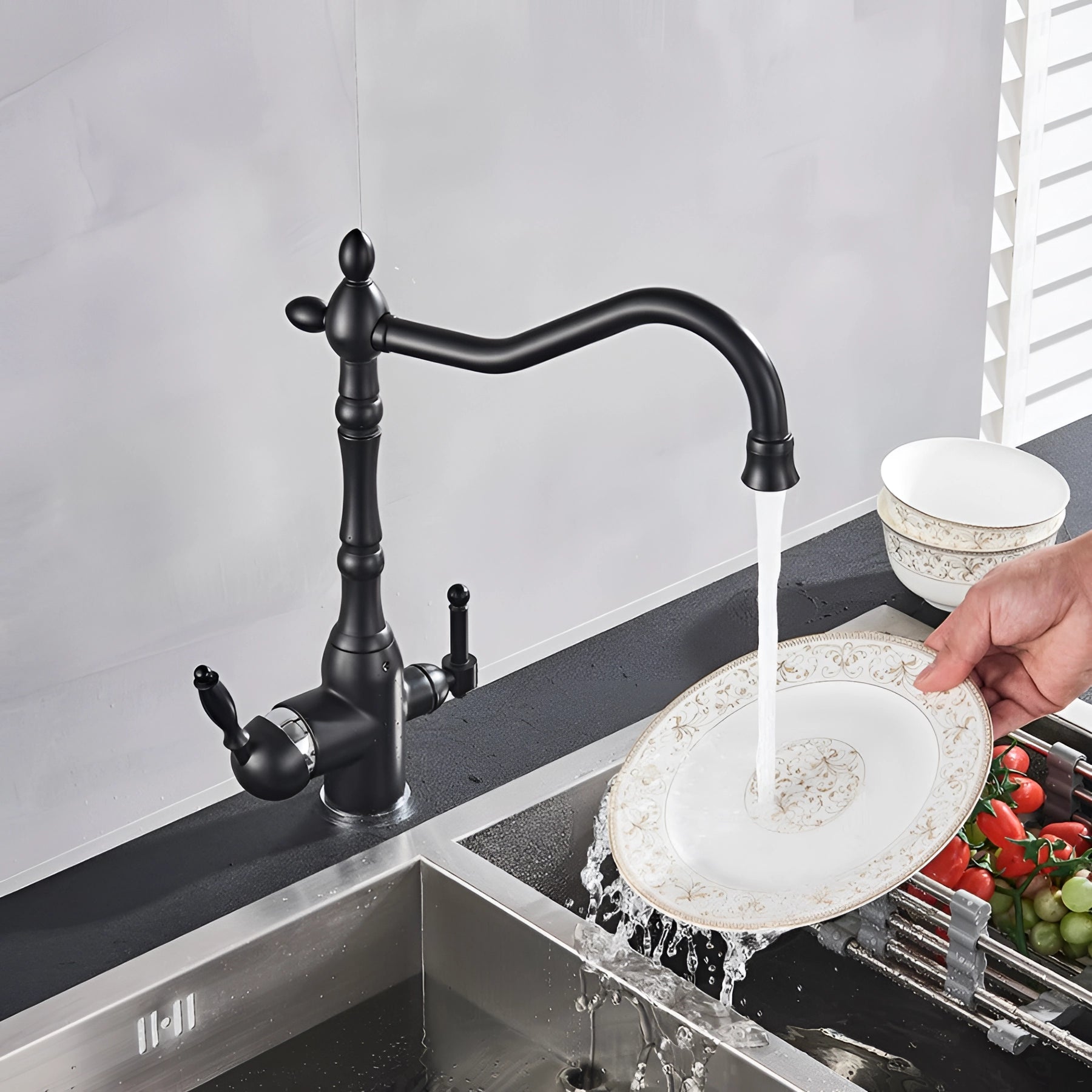 Vintage black gooseneck kitchen faucet in an antique style, featuring a high-arched spout over a sleek countertop with a modern sink.