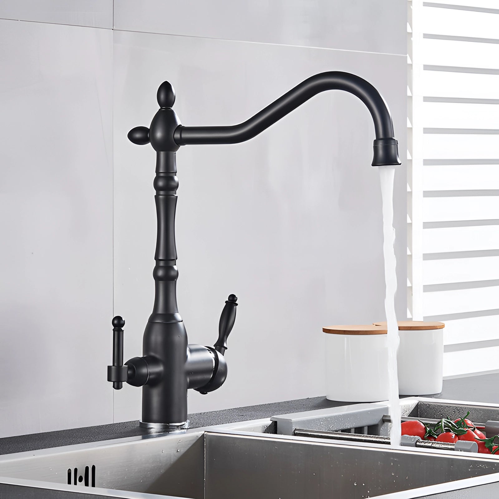 Black vintage-style gooseneck kitchen faucet with an antique design, featuring a sleek metal finish and elegant curves, set against a neutral background.