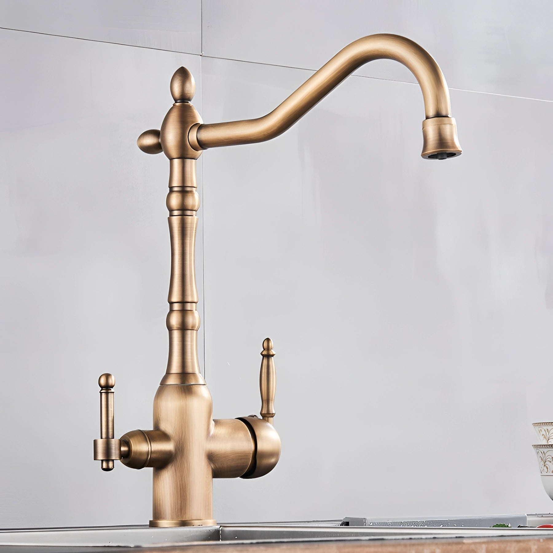Vintage black gooseneck kitchen faucet with an antique style design, featuring a sleek metal finish and curved spout, ideal for adding a classic touch to kitchen sinks.
