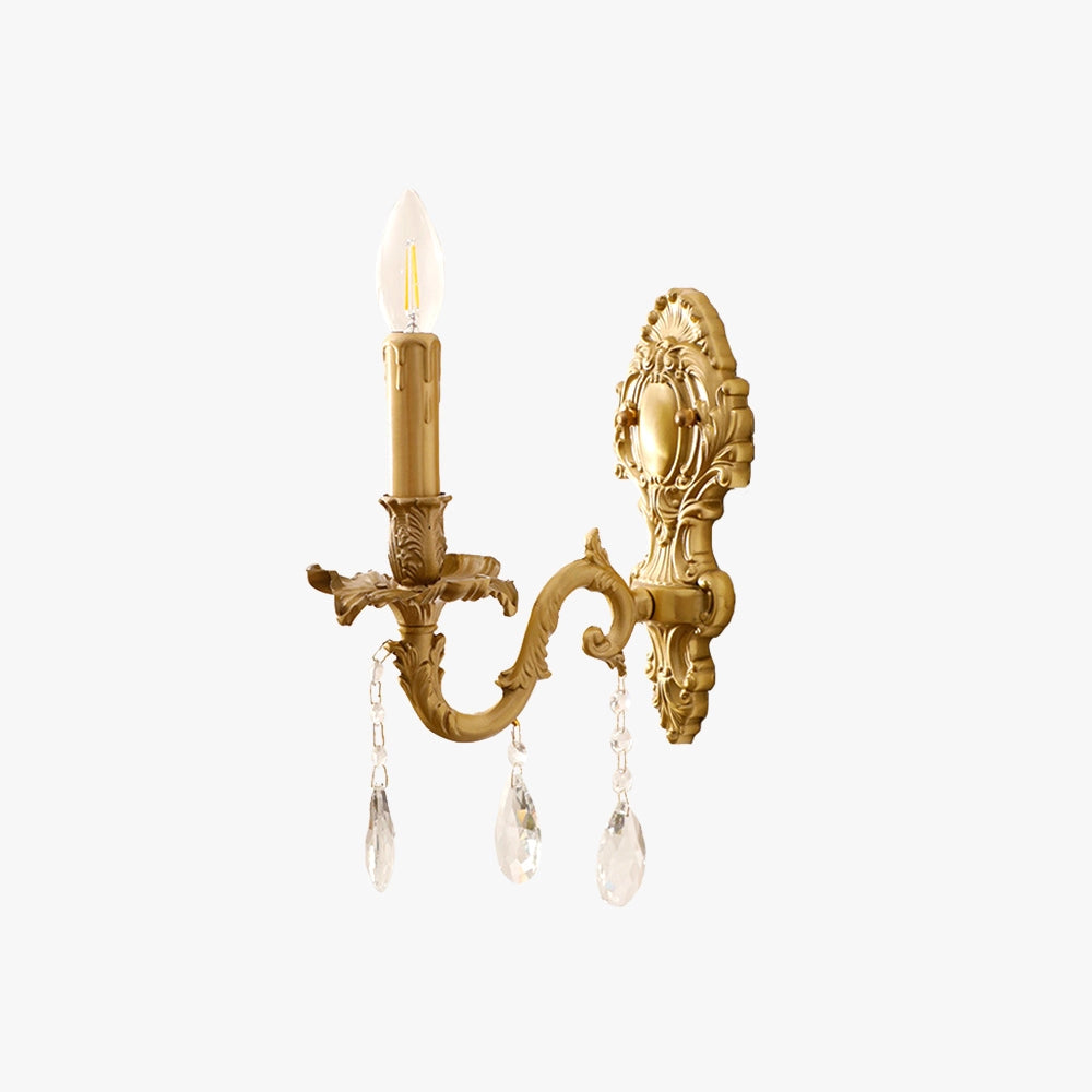 Vintage brass crystal wall sconce in antique gold, featuring a candle-style light fixture with decorative crystal elements and a circular metal base.