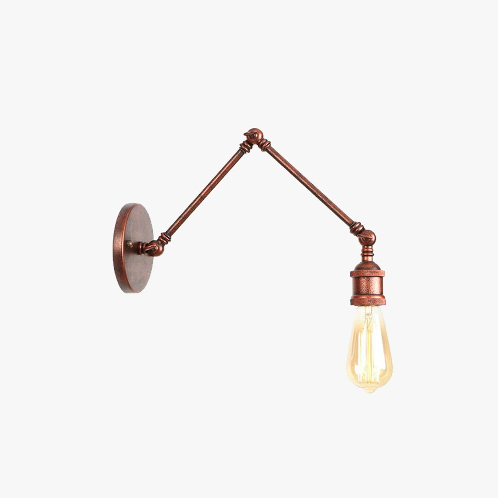 Vintage brass wall lamp with an exposed Edison bulb and adjustable swing arm mounted on a wall. The lamp features a metal construction with an industrial design aesthetic.