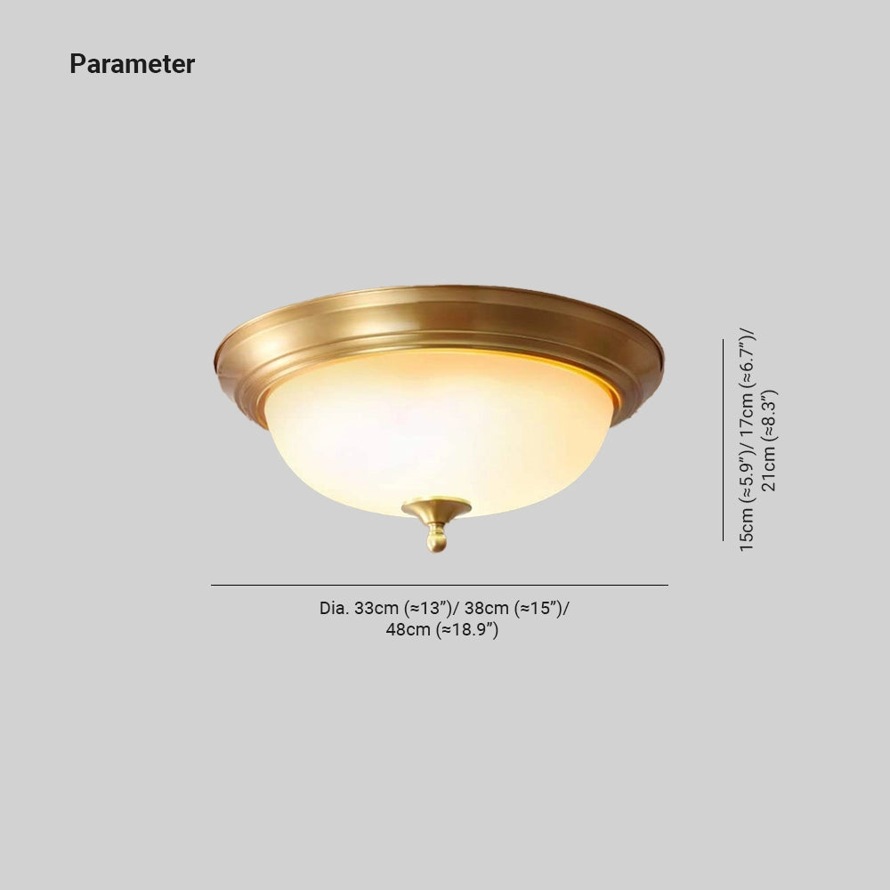 Vintage brass flush mount ceiling light with frosted glass shade featuring an amber hue, metal base, and decorative design, suitable for indoor ceiling installation.