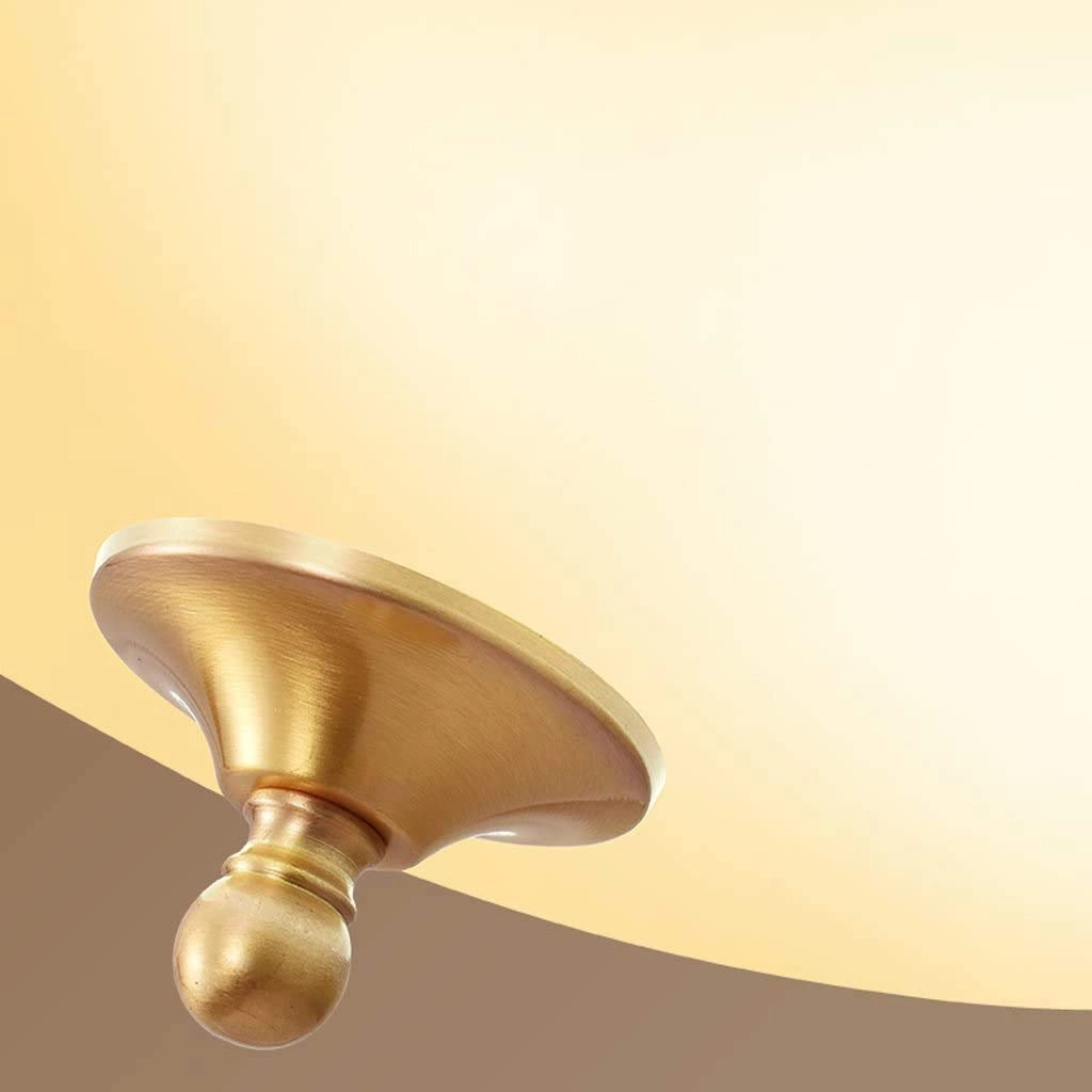 Vintage brass flush mount ceiling light with frosted glass shade, featuring a stylish metal and wood design, mounted on a ceiling.