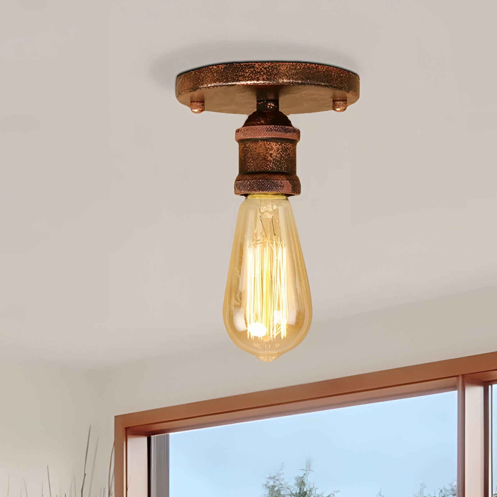 Vintage brass flush mount Edison ceiling fixture with a retro industrial style, featuring a metal base and wooden accents, mounted on a ceiling in a room setting.